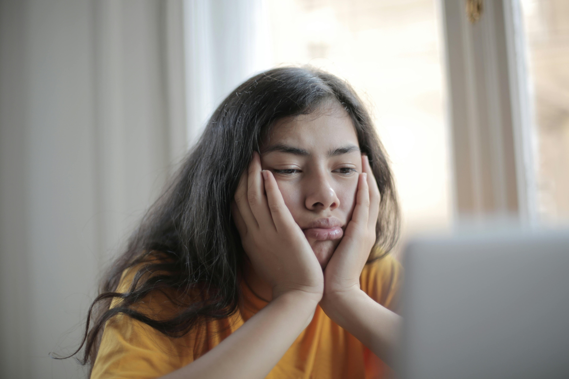 A discouraged student sitting in front of a computer
